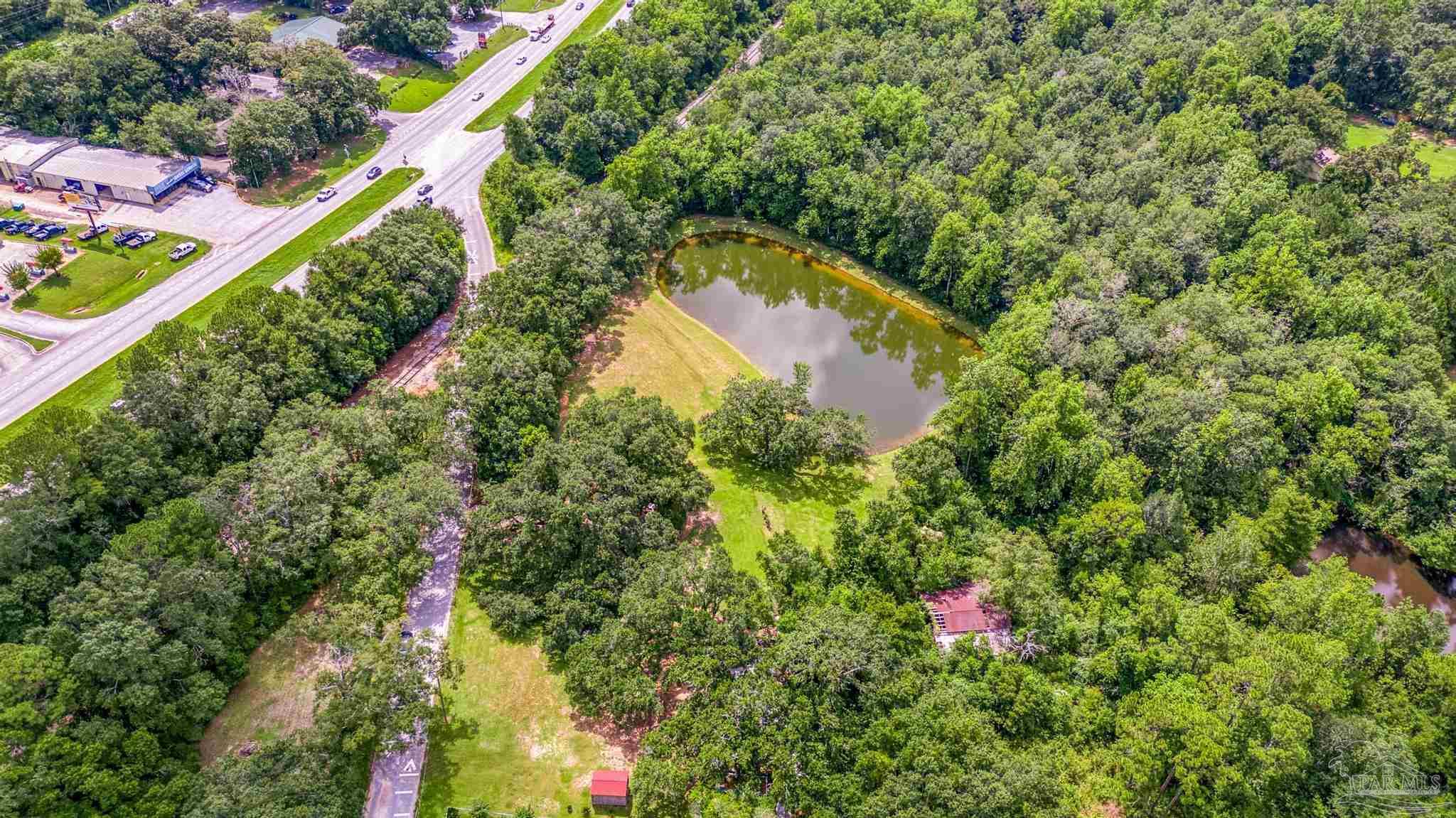 2345 Pompano Street Cantonment, FL 32533 - Photo 33 of 48 a view of a garden with a flower garden
