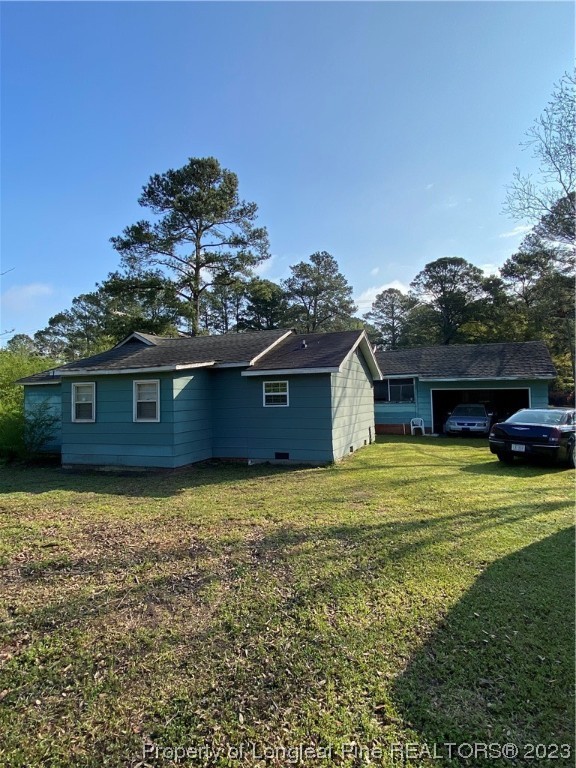 1409 Richardson Road Bladenboro, NC 28320 - Photo 2 of 14 a front view of a house with garden
