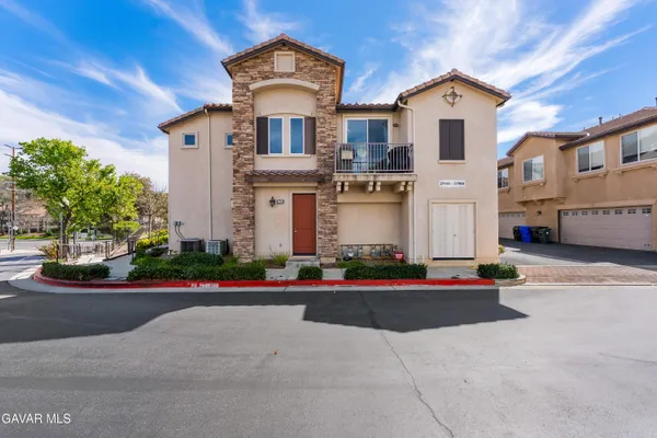 a view of a kitchen with a sink and a stove top oven