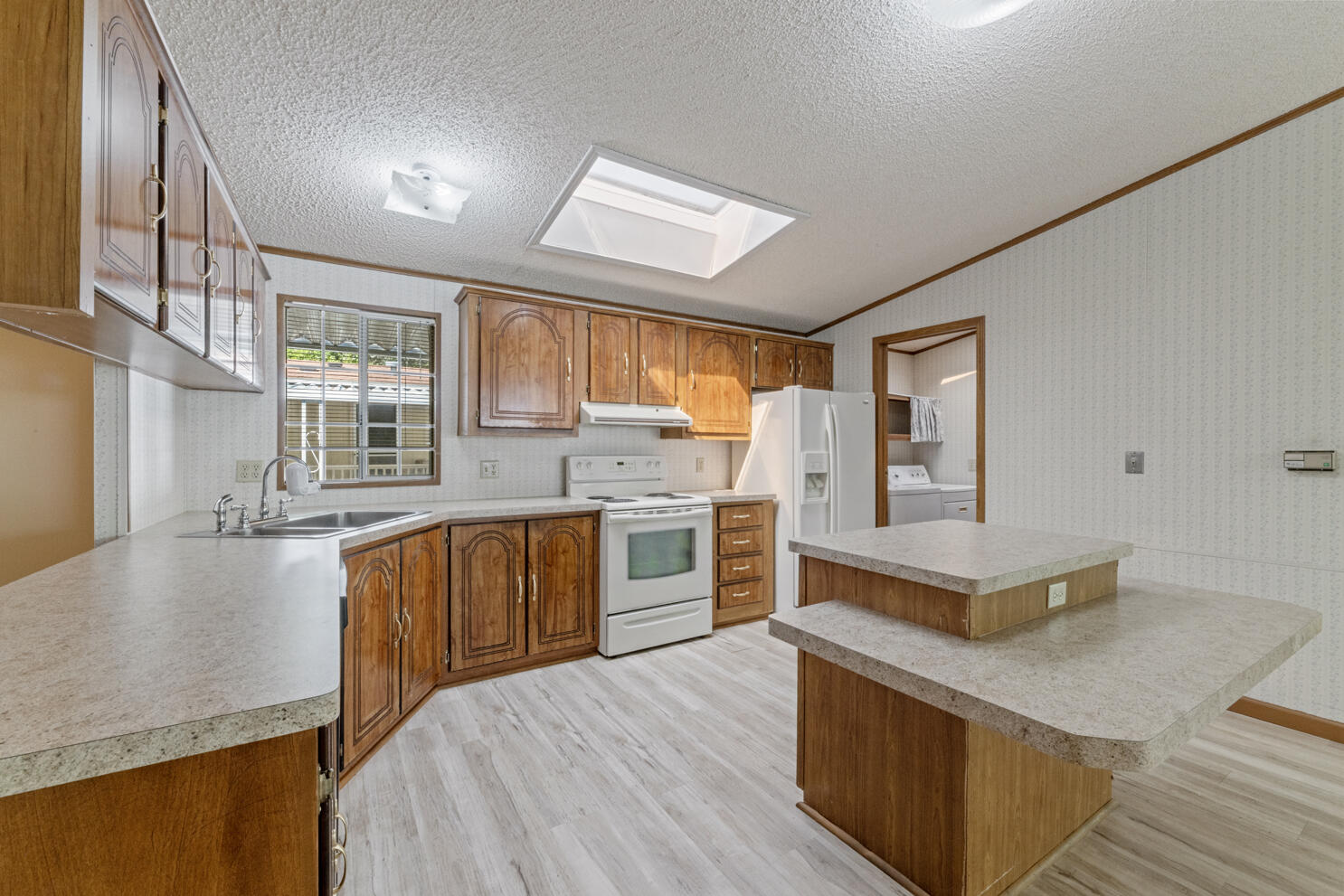 315 West Evans Creek Road, Unit 78 Rogue River, OR 97537 - Photo 13 of 27 a kitchen with stainless steel appliances granite countertop a stove and a sink