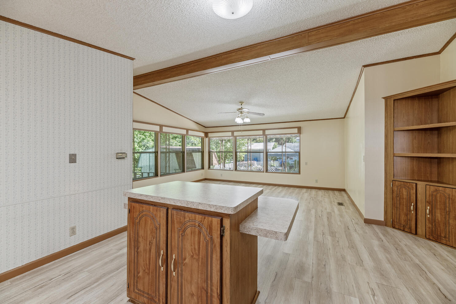 315 West Evans Creek Road, Unit 78 Rogue River, OR 97537 - Photo 16 of 27 a living room with wooden floor and a window