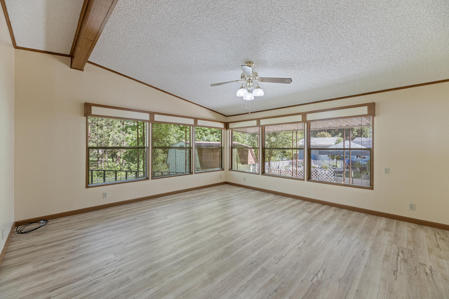 315 West Evans Creek Road, Unit 78 Rogue River, OR 97537 - Photo 17 of 27 a view of an empty room with a window and wooden floor