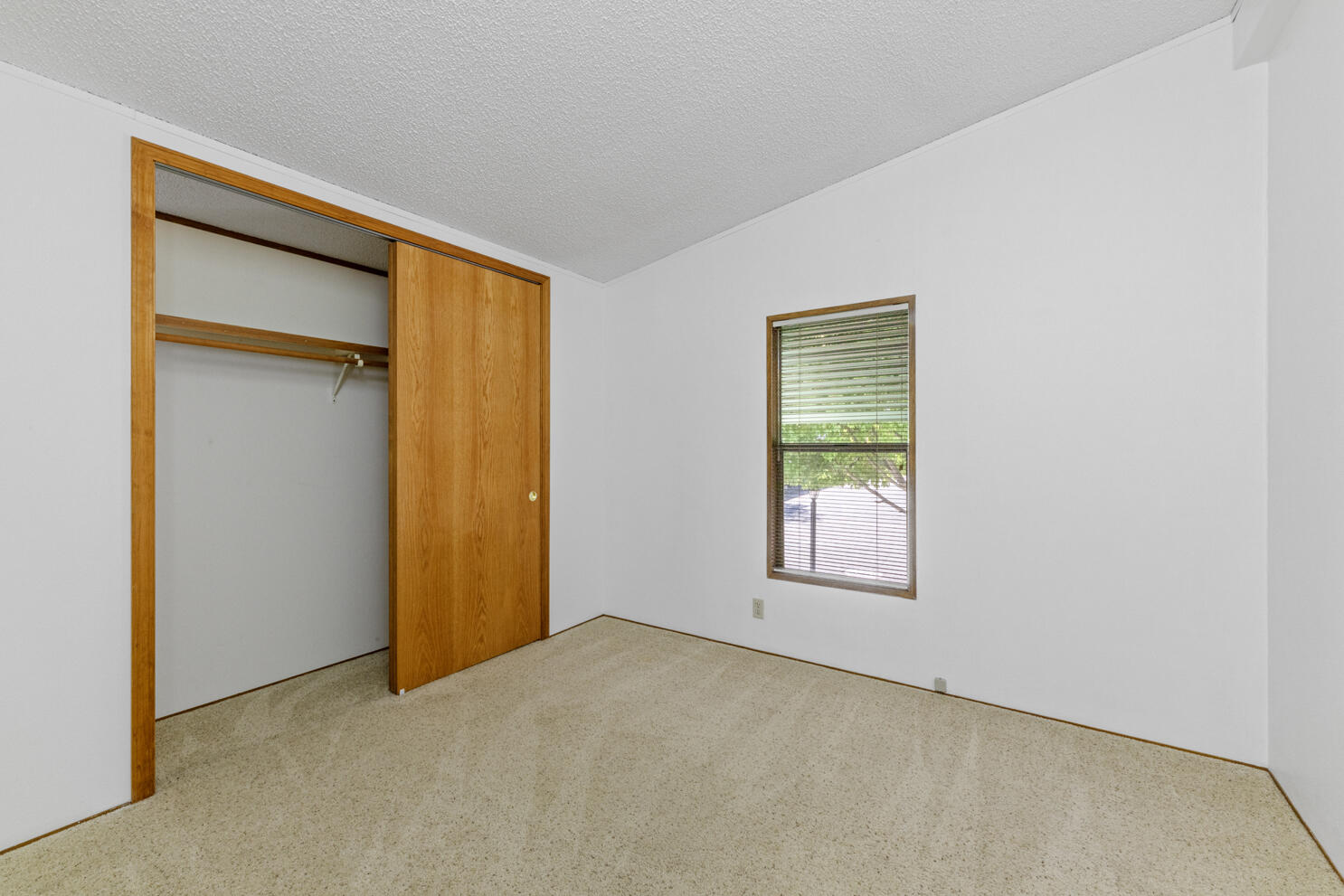 315 West Evans Creek Road, Unit 78 Rogue River, OR 97537 - Photo 21 of 27 an empty room with windows and closet