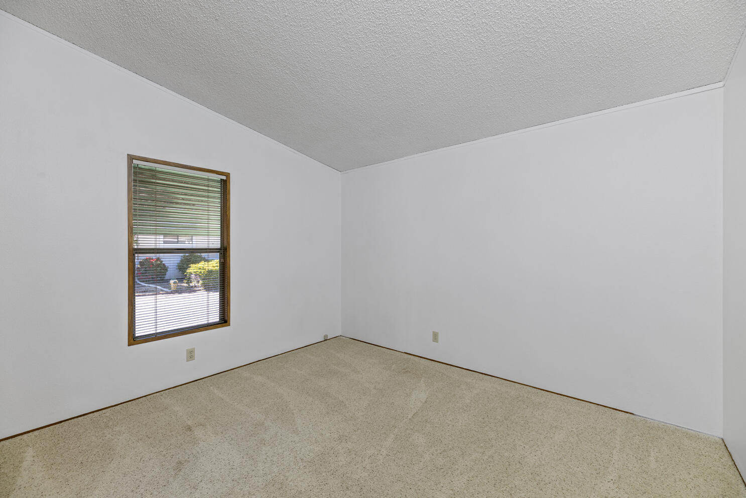 315 West Evans Creek Road, Unit 78 Rogue River, OR 97537 - Photo 22 of 27 an empty room with a window