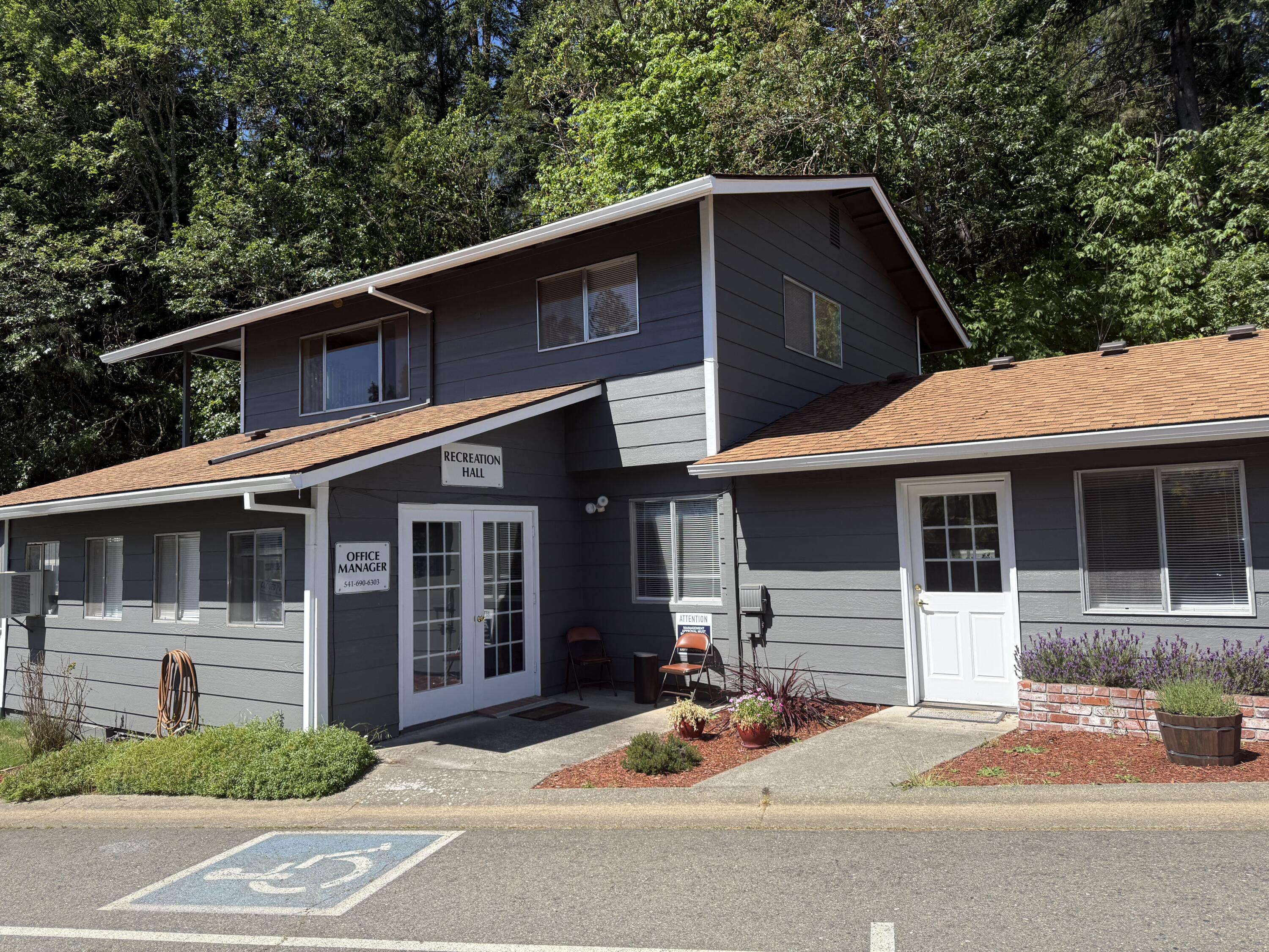 315 West Evans Creek Road, Unit 78 Rogue River, OR 97537 - Photo 24 of 27 a front view of a house with garage