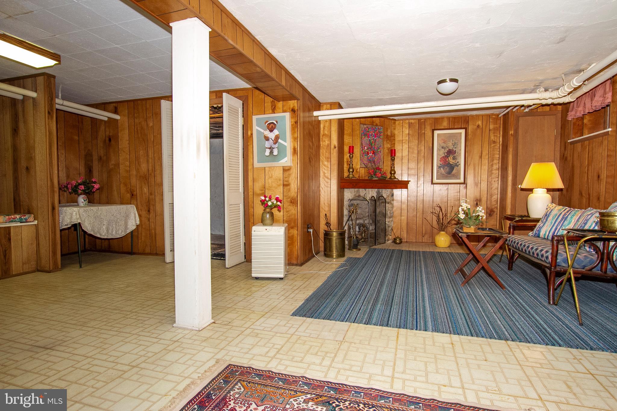 7103 Sheffield Road Baltimore, MD 21212 - Photo 20 of 37 a view of a bedroom with furniture and wooden floor