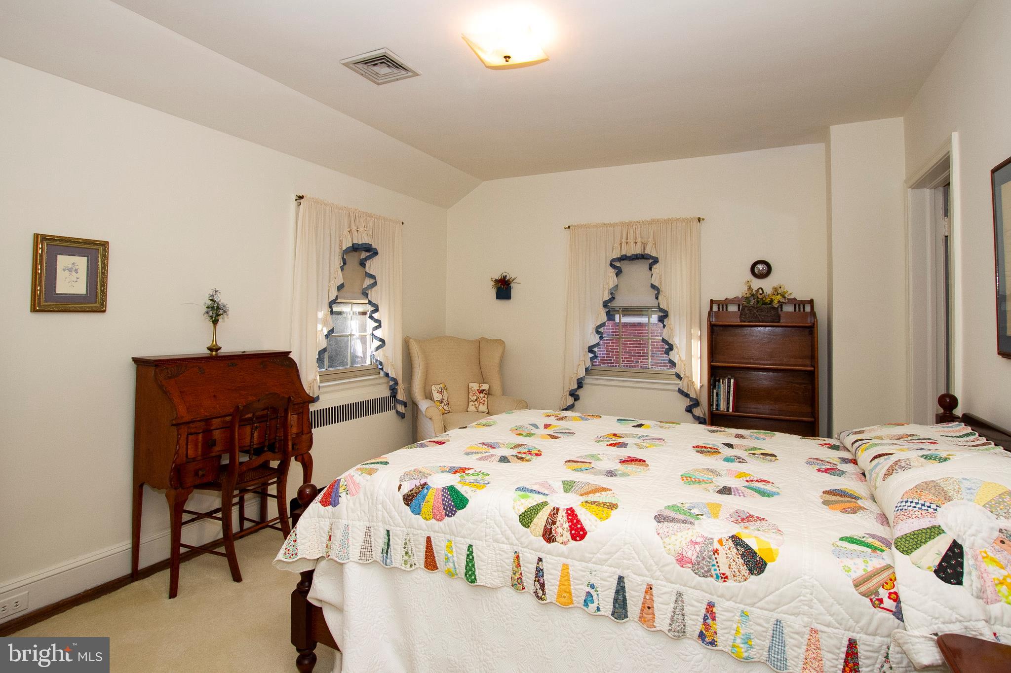 7103 Sheffield Road Baltimore, MD 21212 - Photo 24 of 37 a bedroom with a bed and a table in it