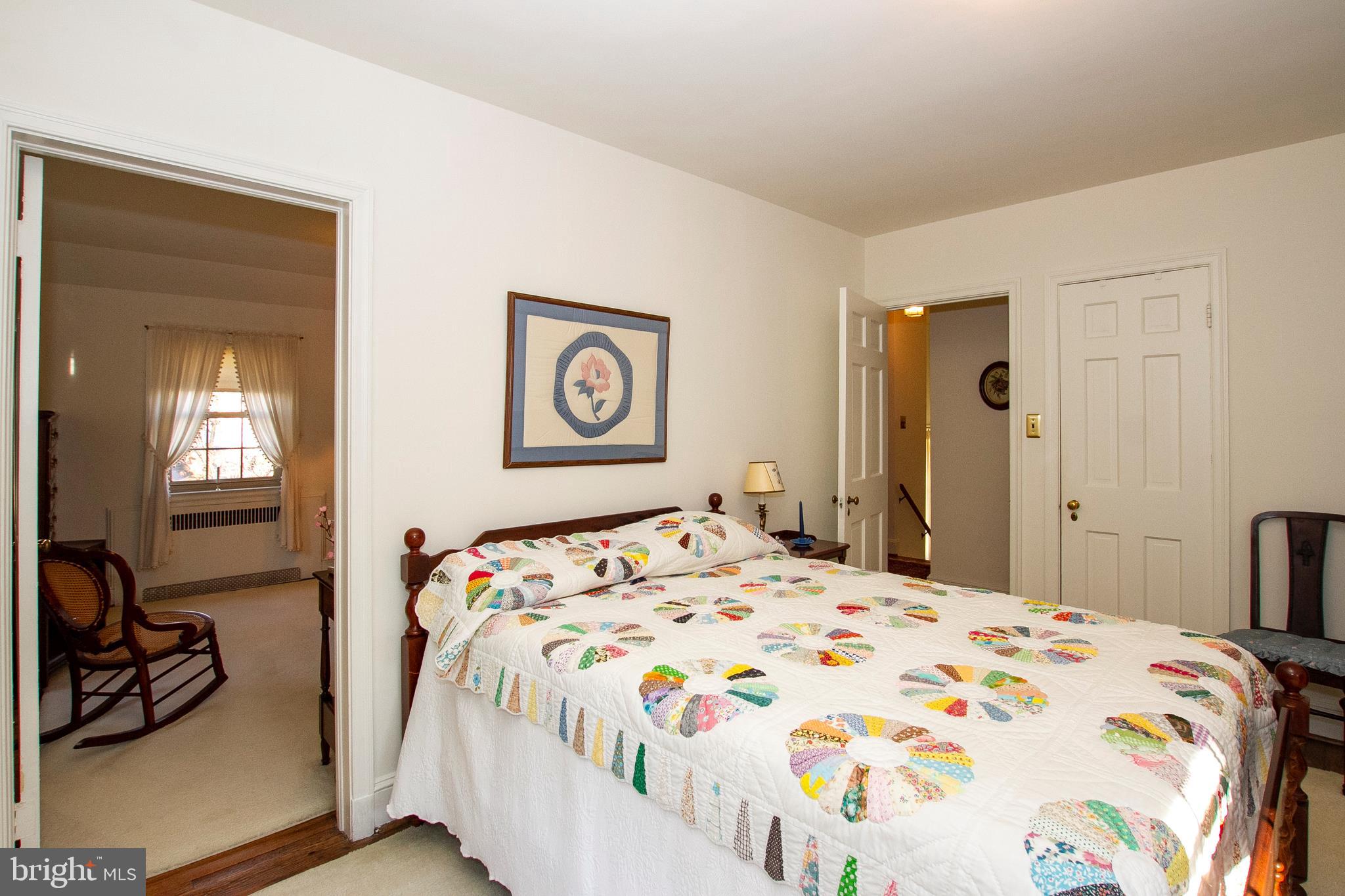 7103 Sheffield Road Baltimore, MD 21212 - Photo 25 of 37 a bedroom with a bed and a view of bathroom