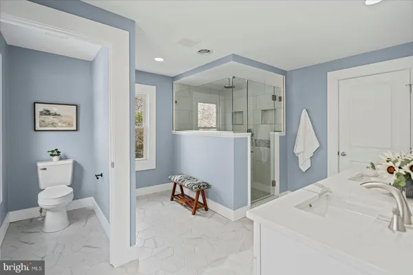 a bathroom with a sink a vanity and a mirror