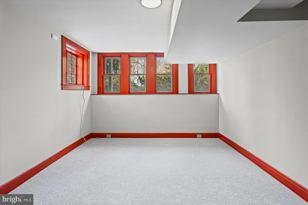 a view of empty room with a fireplace