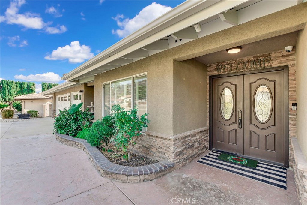8317 La Senda Road Rancho Cucamonga, CA 91701 - Photo 11 of 75 a front view of a house with garden