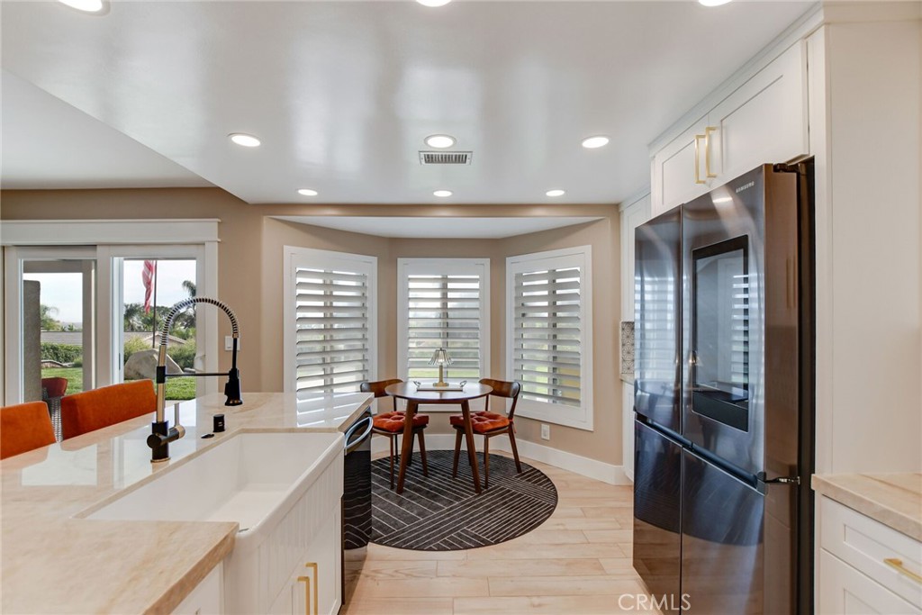 8317 La Senda Road Rancho Cucamonga, CA 91701 - Photo 22 of 75 a living room with furniture a window and stainless steel appliances