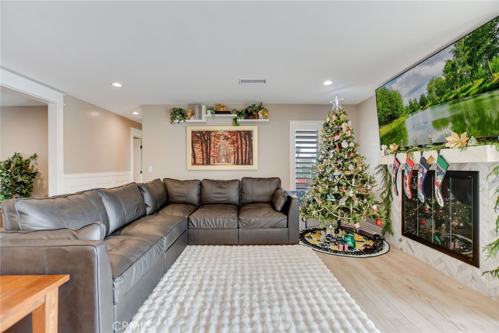 8317 La Senda Road Rancho Cucamonga, CA 91701 - Photo 25 of 75 a living room with furniture and a christmas tree
