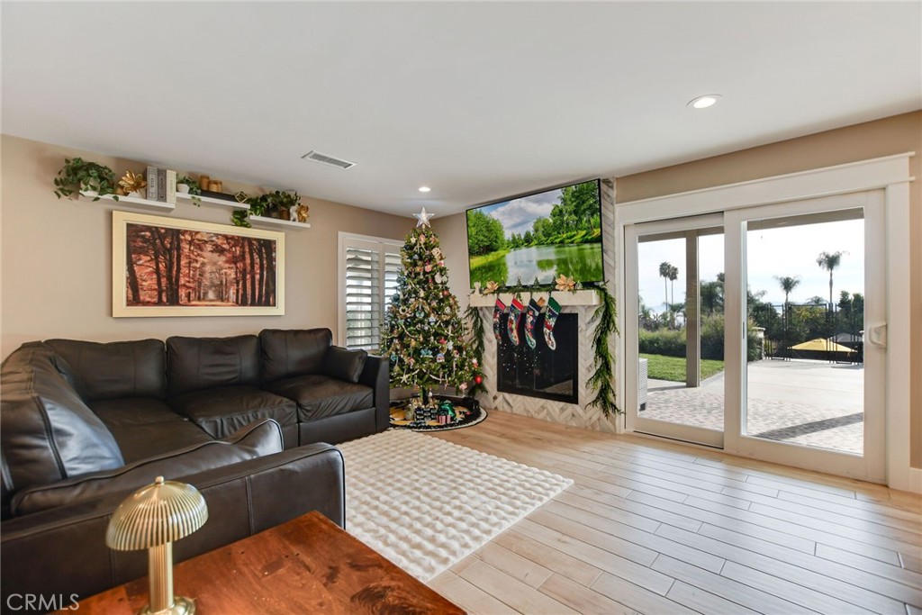 8317 La Senda Road Rancho Cucamonga, CA 91701 - Photo 26 of 75 a living room with furniture and a large window