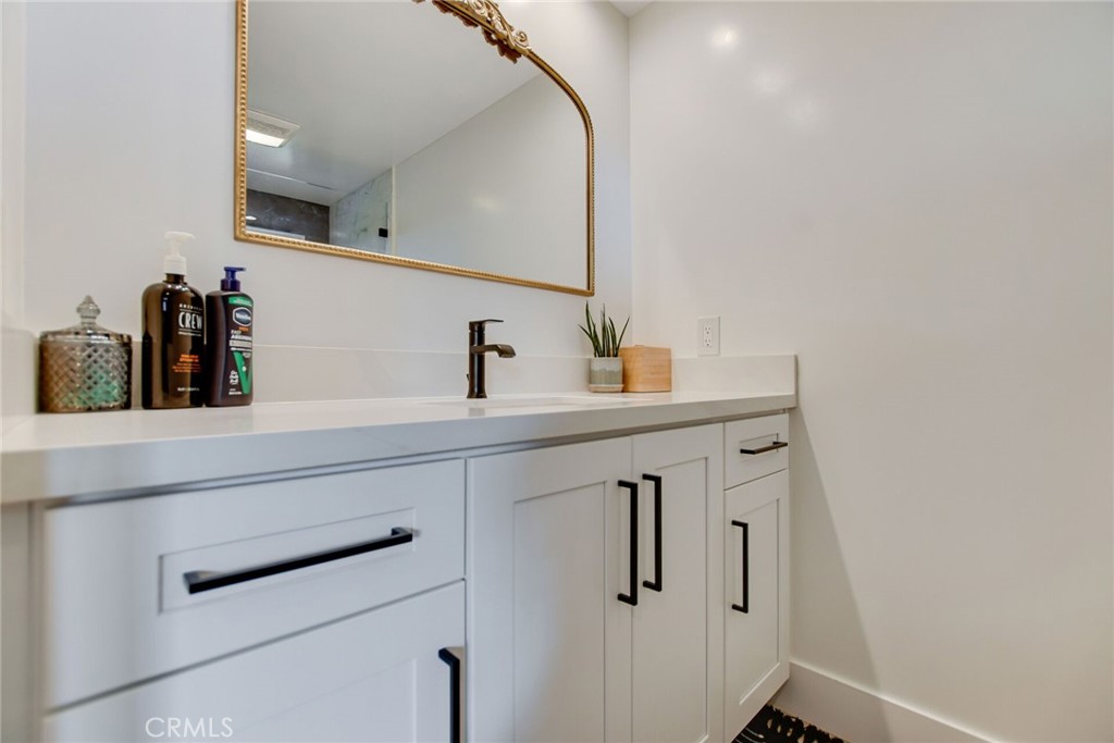 8317 La Senda Road Rancho Cucamonga, CA 91701 - Photo 40 of 75 a bathroom with a sink and a mirror