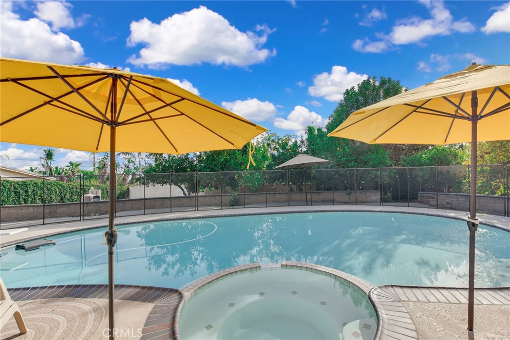 8317 La Senda Road Rancho Cucamonga, CA 91701 - Photo 60 of 75 a view of a swimming pool with a patio and yard of fire pit