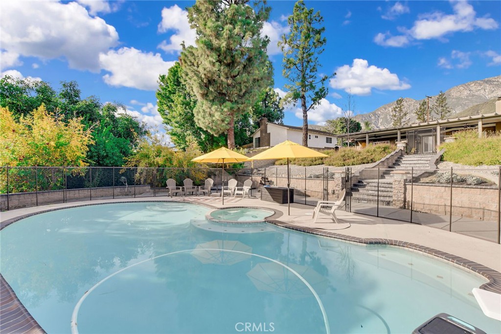 8317 La Senda Road Rancho Cucamonga, CA 91701 - Photo 62 of 75 a view of a swimming pool with lounge chairs