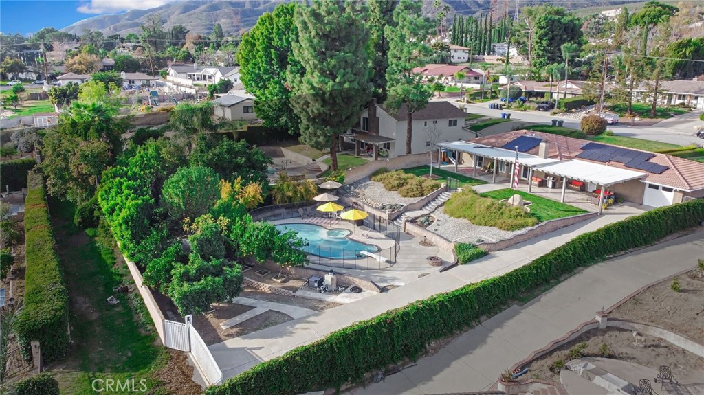 8317 La Senda Road Rancho Cucamonga, CA 91701 - Photo 68 of 75 an aerial view of a house with a garden and lake view