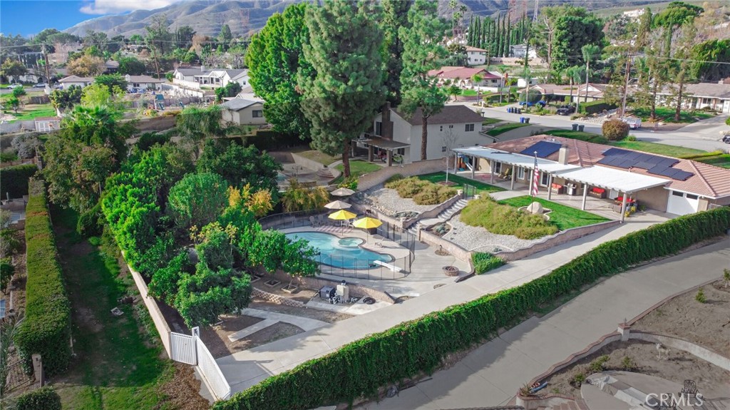 8317 La Senda Road Rancho Cucamonga, CA 91701 - Photo 71 of 75 an aerial view of a house with a garden and lake view