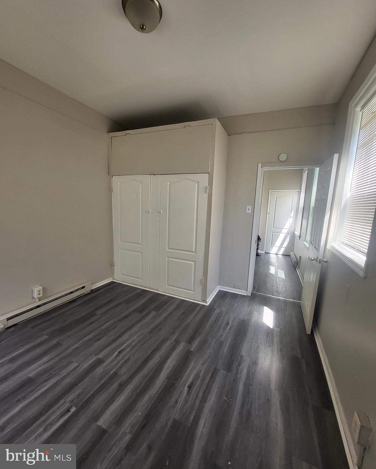 3948 North 5th Street Philadelphia, PA 19140 - Photo 4 of 7 wooden floor in an empty room
