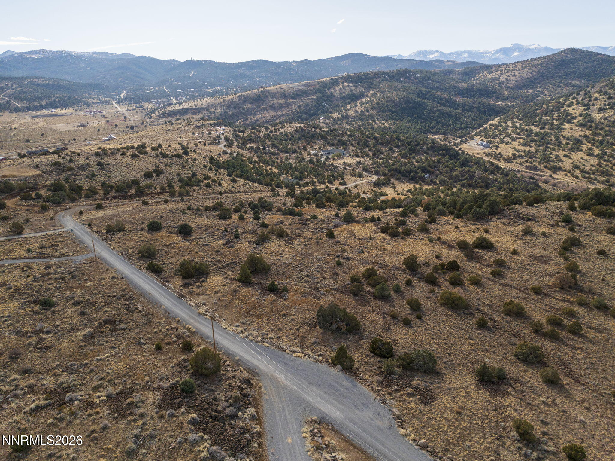 2690 Goldfield Road, Unit PARCEL IS BORDERED BY GOLDFIELD ON SOUTH AND EAST Reno, NV 89521 - Photo 21 of 30 a view of a forest with mountains in the background
