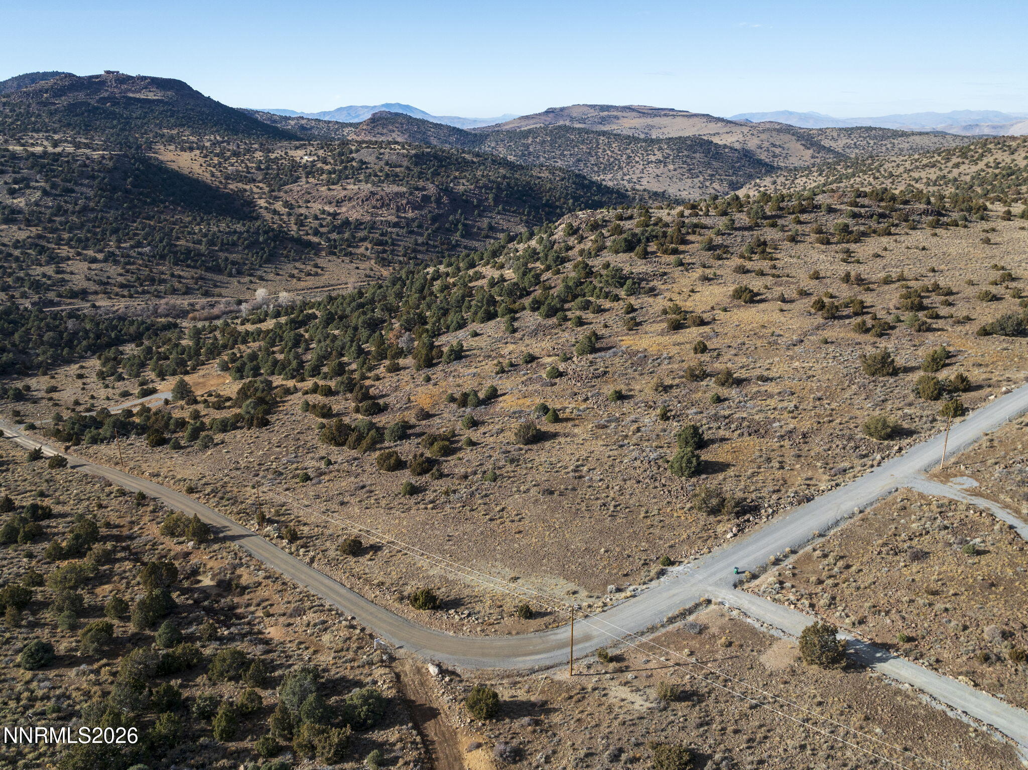 2690 Goldfield Road, Unit PARCEL IS BORDERED BY GOLDFIELD ON SOUTH AND EAST Reno, NV 89521 - Photo 23 of 30 a view of a dry field with mountains in the background