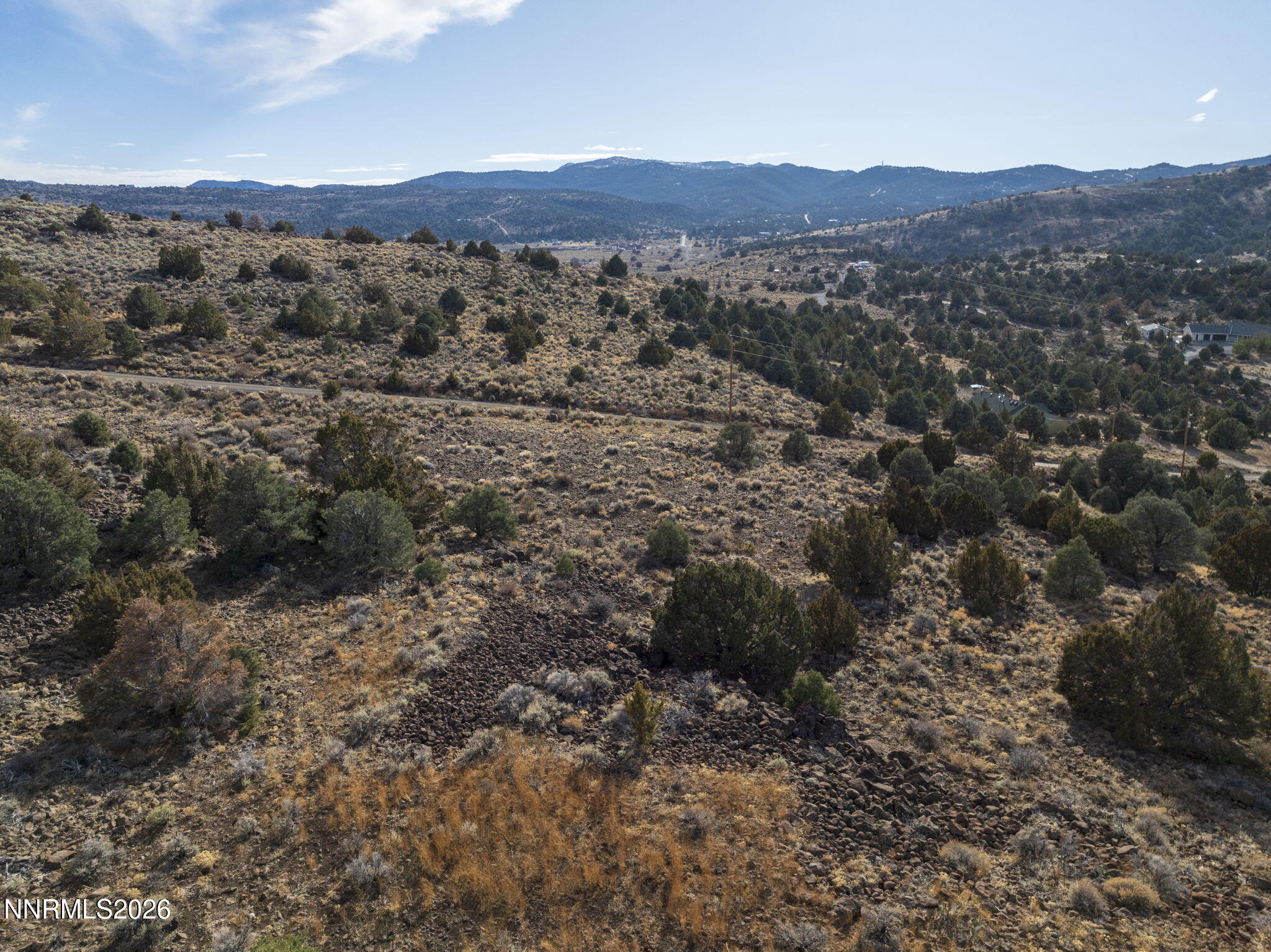 2690 Goldfield Road, Unit PARCEL IS BORDERED BY GOLDFIELD ON SOUTH AND EAST Reno, NV 89521 - Photo 26 of 30 a view of a large mountains with green field and mountain view