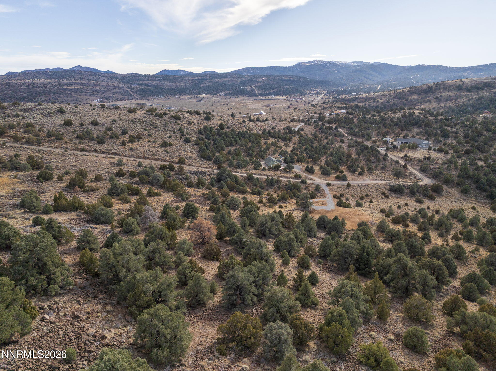 2690 Goldfield Road, Unit PARCEL IS BORDERED BY GOLDFIELD ON SOUTH AND EAST Reno, NV 89521 - Photo 4 of 30 a view of a lush green hillside and a houses