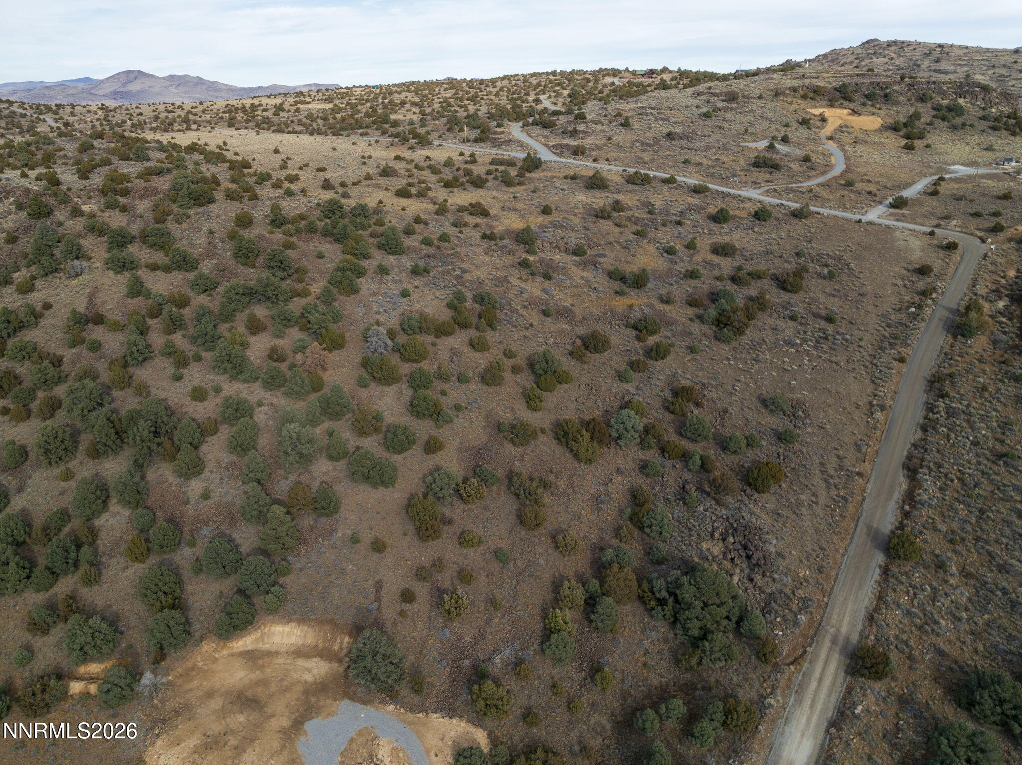 2690 Goldfield Road, Unit PARCEL IS BORDERED BY GOLDFIELD ON SOUTH AND EAST Reno, NV 89521 - Photo 10 of 30 a view of a dry yard with mountains and green space