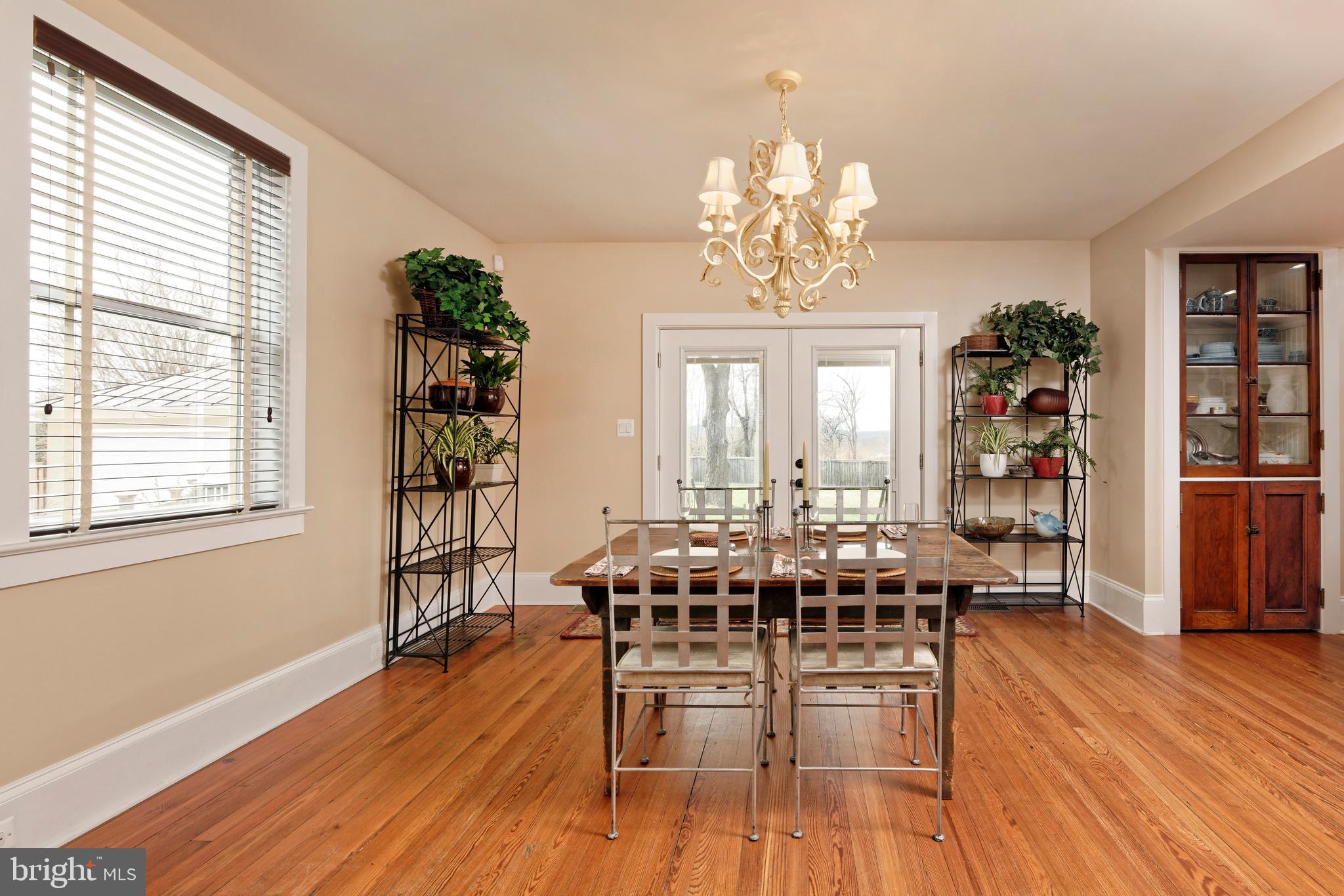 4048 Rectortown Road Marshall, VA 20115 - Photo 13 of 52 a view of a dining room with furniture window and wooden floor