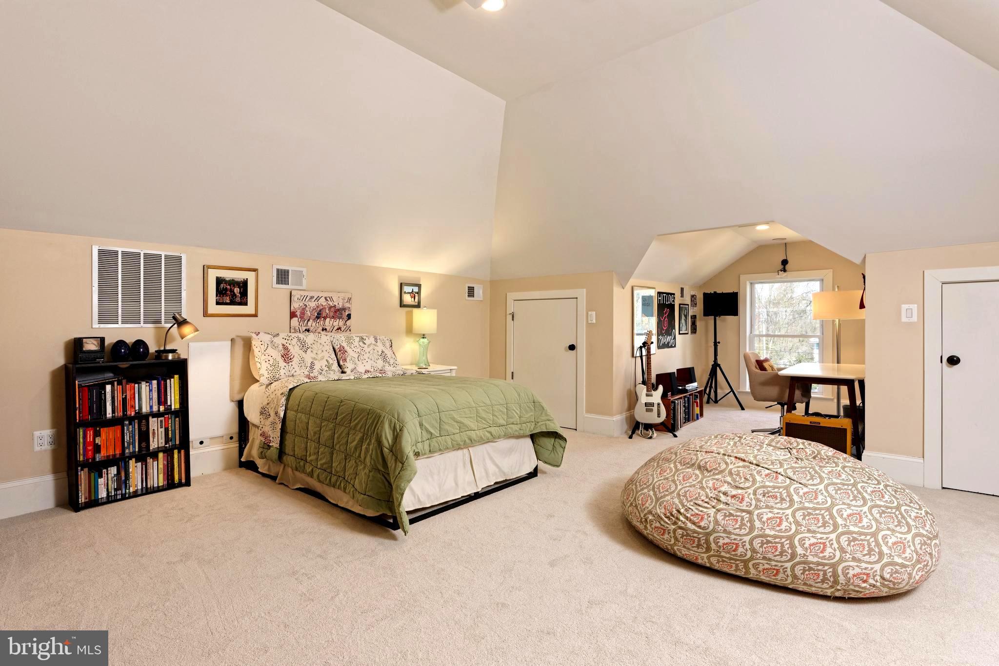 4048 Rectortown Road Marshall, VA 20115 - Photo 27 of 52 a spacious bedroom with a bed a couch and a large mirror