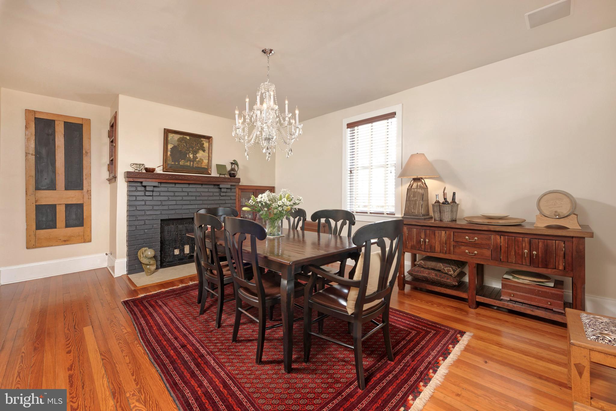 4048 Rectortown Road Marshall, VA 20115 - Photo 8 of 52 a view of a dining room with furniture a chandelier and wooden floor