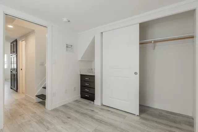 an empty room with wooden floor