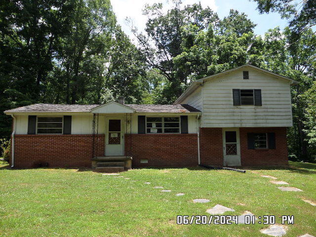 5982 Brethren Road Roanoke, VA 24014 - Photo 1 of 10 a front view of a house with a garden