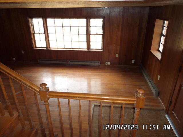 5982 Brethren Road Roanoke, VA 24014 - Photo 4 of 10 a view of an empty room with wooden floor and a window
