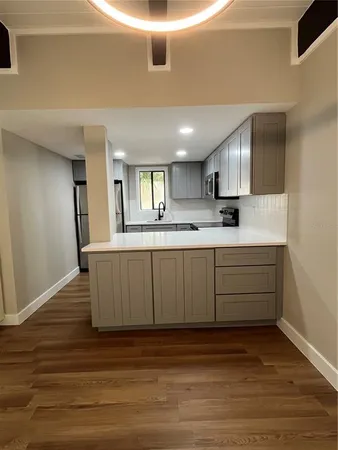 a view of kitchen with wooden floor