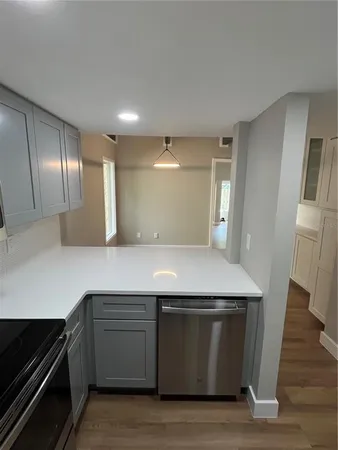 a kitchen with a stove and a refrigerator