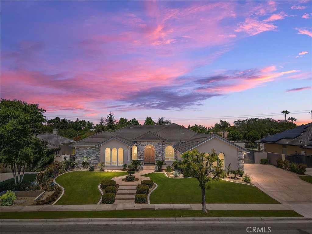 12400 Trinity River Drive Bakersfield, CA 93312 - Photo 1 of 1 a front view of a house with a yard