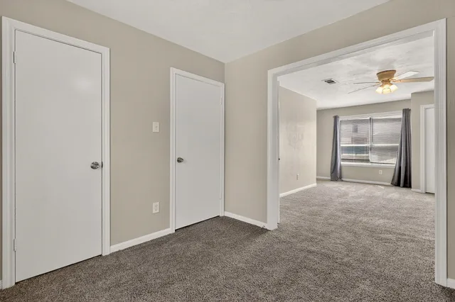 a view of a big room with closet and cabinet