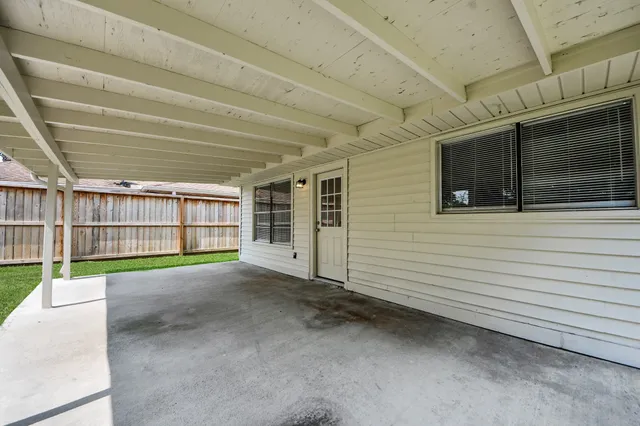 a view of a porch with furniture