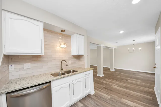 a kitchen with a sink and cabinets