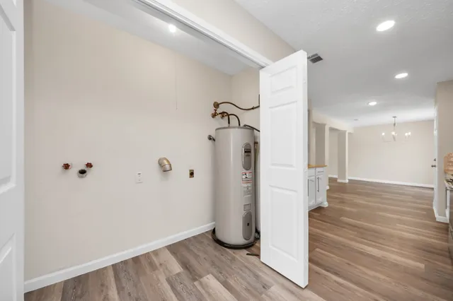 a view of an entryway with wooden floor