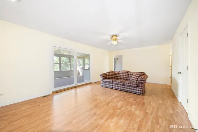 a room with a bed and window