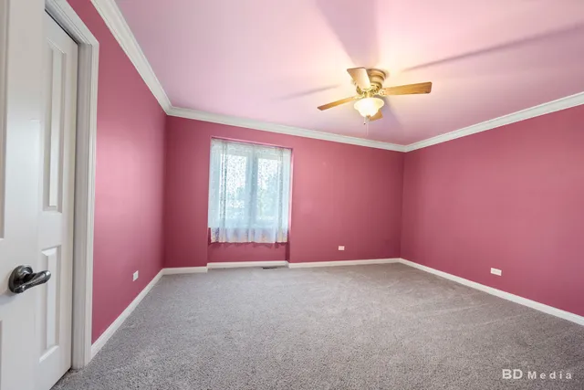 wooden floor and chandelier fan in a room