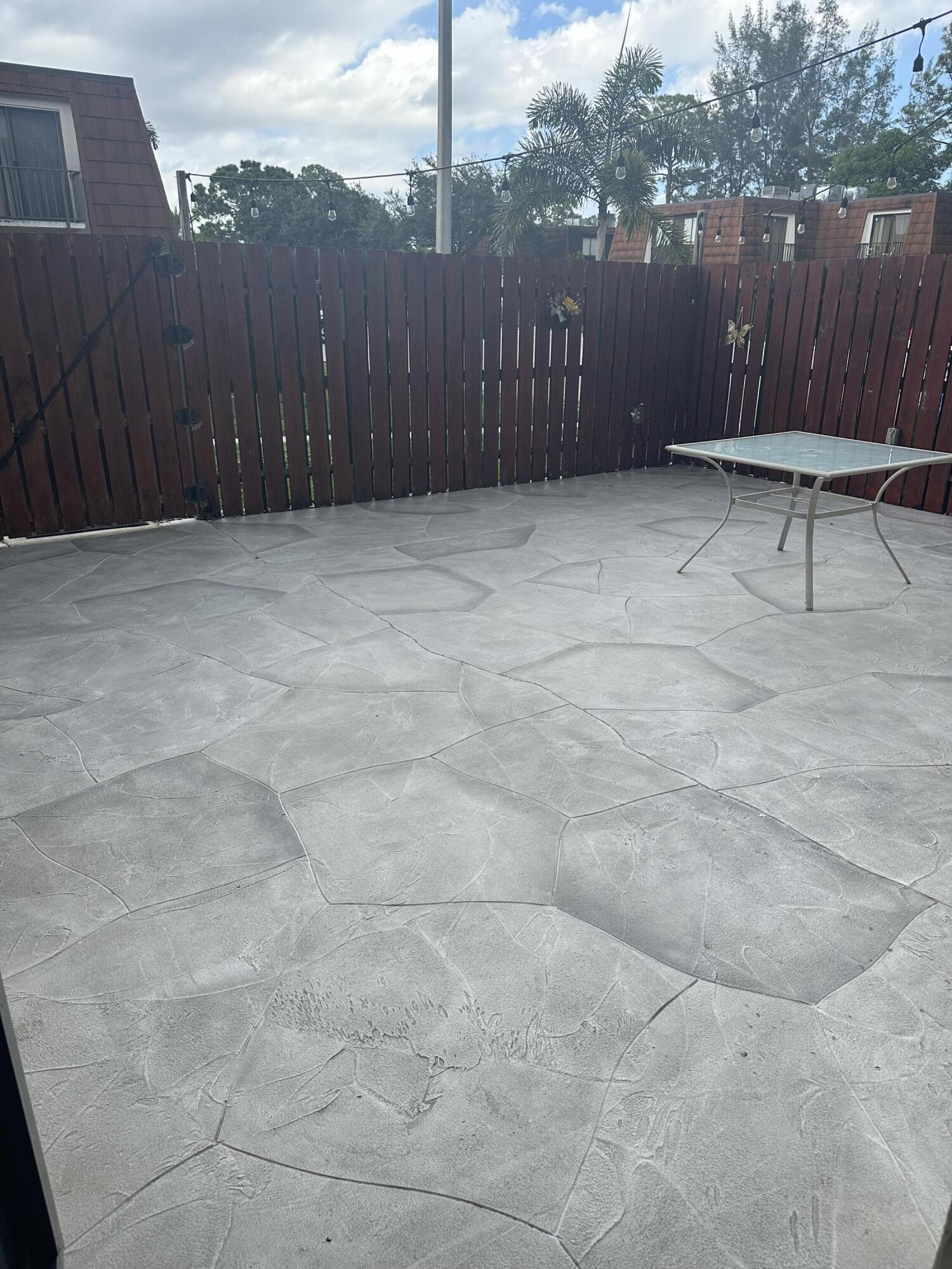 2201 White Pine Circle, Unit B Greenacres, FL 33415 - Photo 13 of 14 a view of a backyard