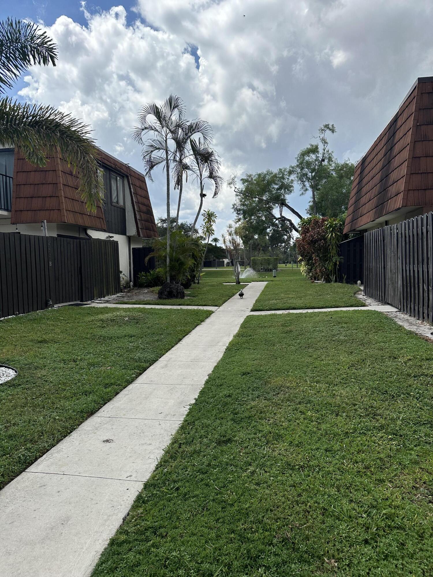 2201 White Pine Circle, Unit B Greenacres, FL 33415 - Photo 2 of 14 a view of a backyard