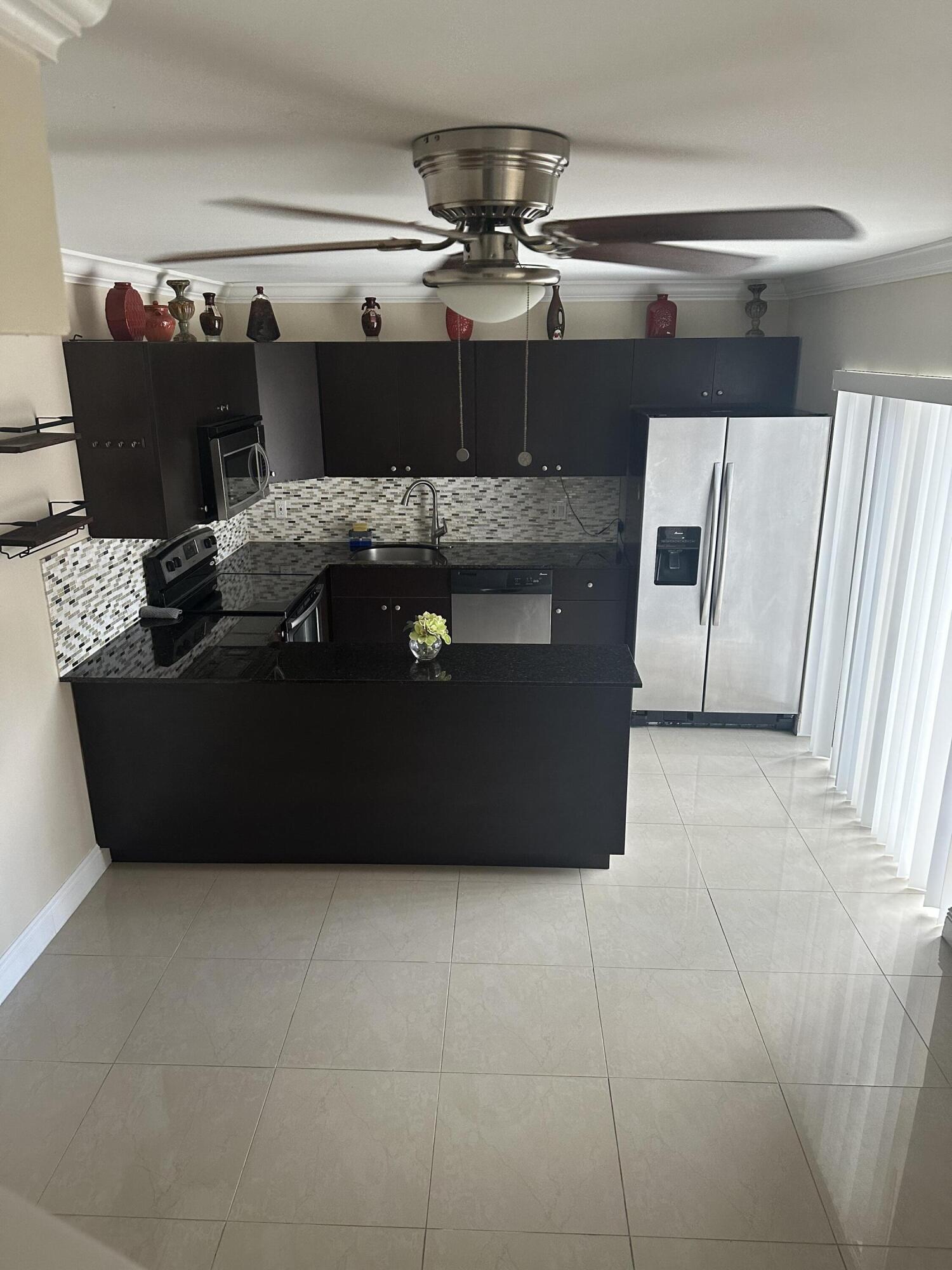 2201 White Pine Circle, Unit B Greenacres, FL 33415 - Photo 4 of 14 a close view of washer and dryer