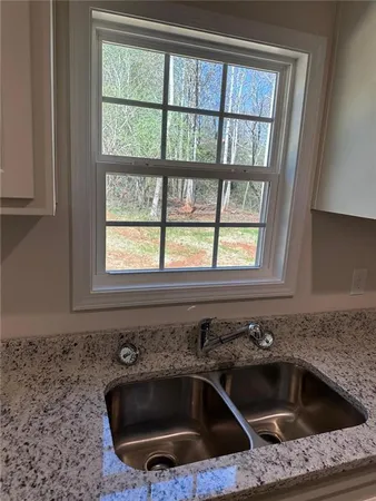 a kitchen with a sink and a window