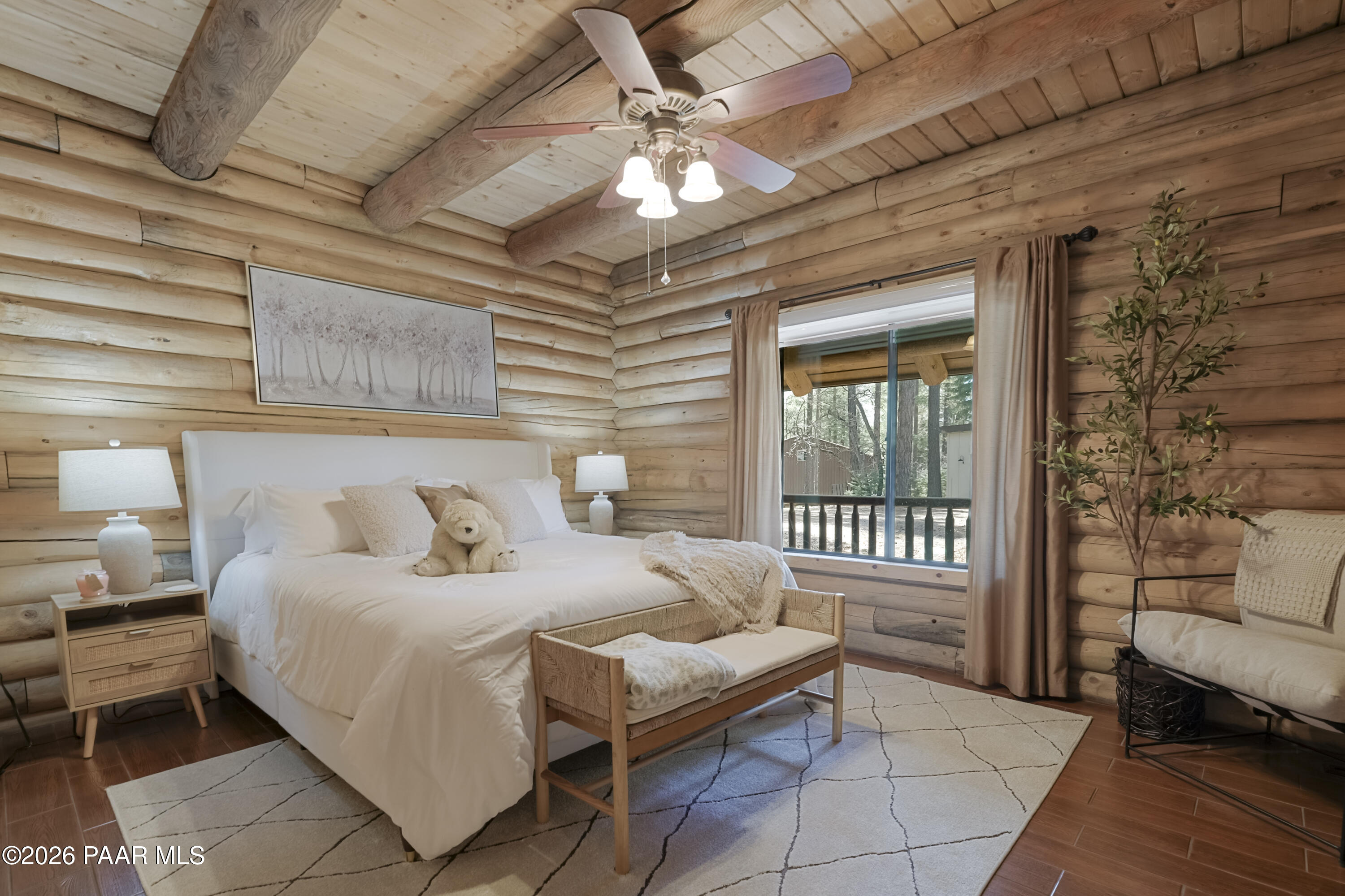 8105 South Comstock Mine Road Prescott, AZ 86303 - Photo 15 of 61 a bedroom with a bed and a table