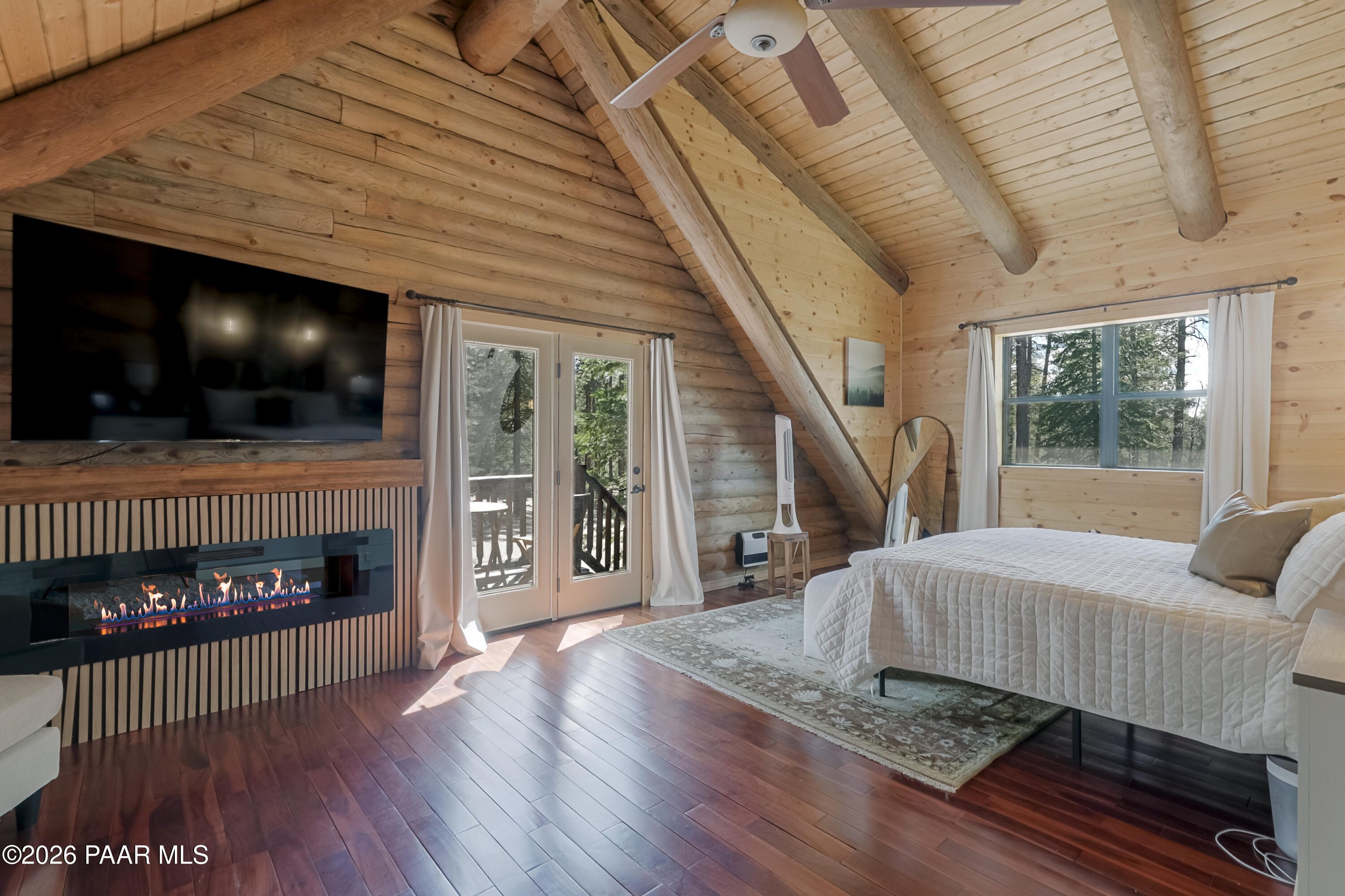 8105 South Comstock Mine Road Prescott, AZ 86303 - Photo 17 of 61 a living room with furniture and a fireplace